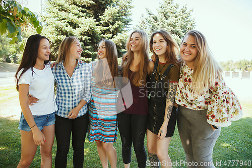 Image of Happy women outdoors on sunny day. Girl power concept.