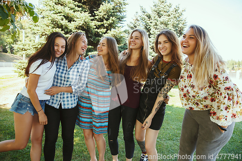 Image of Happy women outdoors on sunny day. Girl power concept.