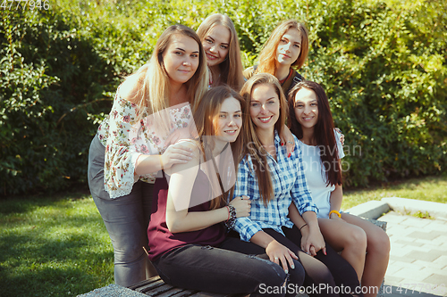 Image of Happy women outdoors on sunny day. Girl power concept.