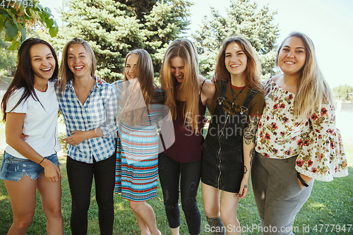 Image of Happy women outdoors on sunny day. Girl power concept.