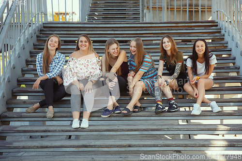 Image of Happy women outdoors on sunny day. Girl power concept.