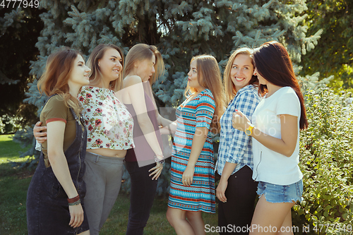 Image of Happy women outdoors on sunny day. Girl power concept.