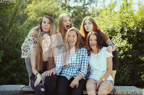 Image of Happy women outdoors on sunny day. Girl power concept.