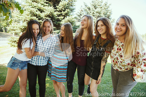 Image of Happy women outdoors on sunny day. Girl power concept.