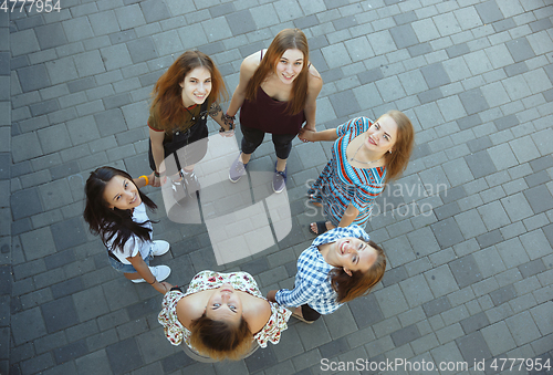 Image of Happy women outdoors on sunny day. Girl power concept.