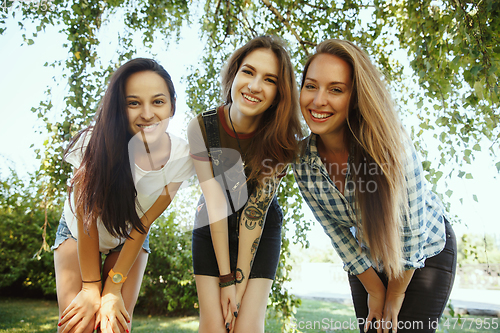 Image of Happy women outdoors on sunny day. Girl power concept.