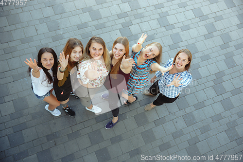 Image of Happy women outdoors on sunny day. Girl power concept.