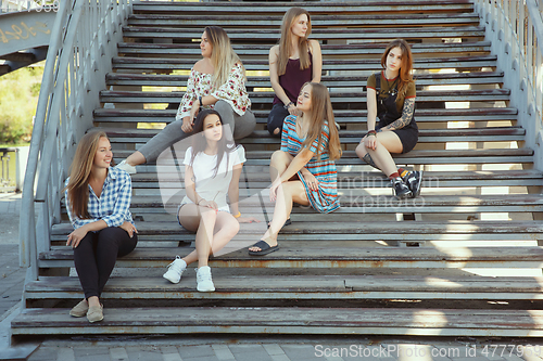 Image of Happy women outdoors on sunny day. Girl power concept.