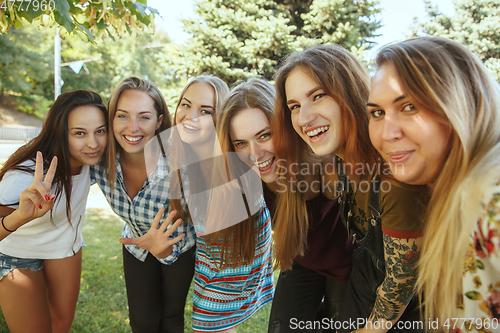 Image of Happy women outdoors on sunny day. Girl power concept.