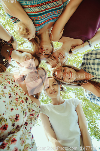 Image of Happy women outdoors on sunny day. Girl power concept.