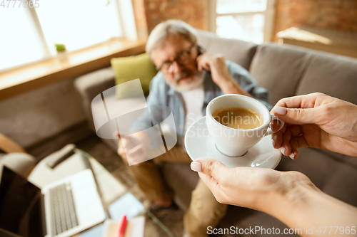 Image of Senior man working with laptop at home - concept of home studying