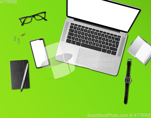Image of Office desk mockup top view isolated on green