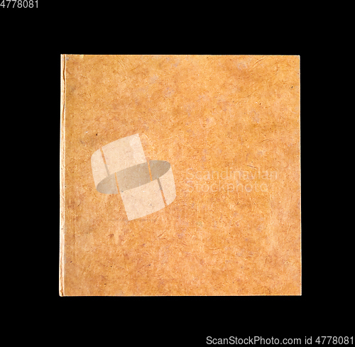 Image of Closed blank notebook isolated on black