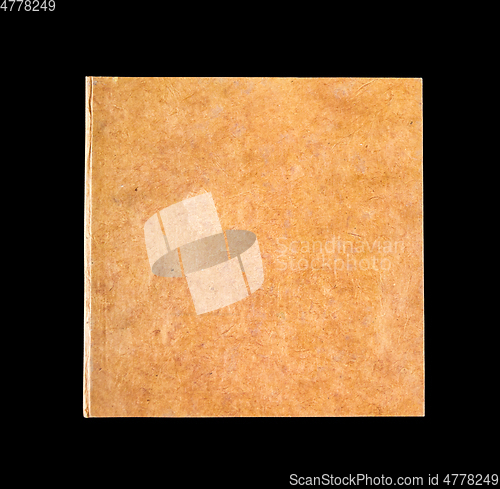 Image of Closed blank notebook isolated on black