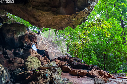 Image of Buddha in cave, Wat Suwan Kuha temple, Thailand