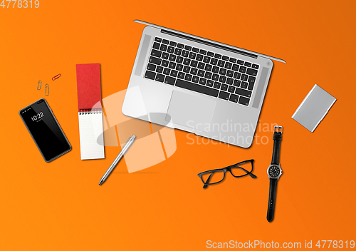 Image of Office desk mockup top view isolated on orange