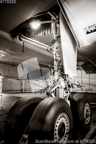 Image of Airplane landing gear detail. Black and white photo