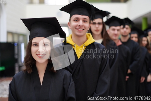 Image of Group of diverse international graduating students celebrating