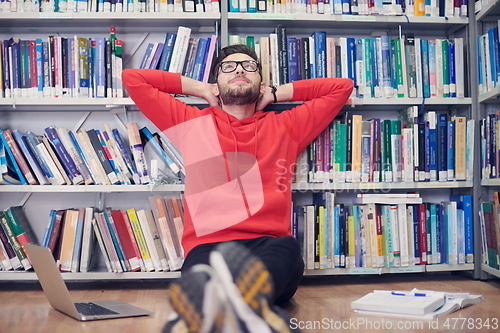 Image of the students uses a notebook, laptop and a school library