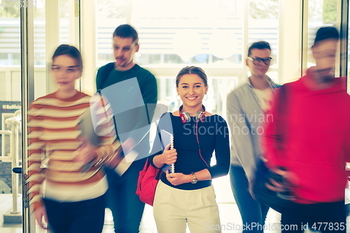 Image of famel student with modern technology in school