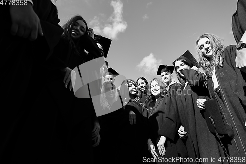 Image of Group of diverse international graduating students celebrating