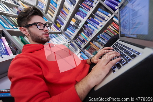 Image of the students uses a notebook, laptop and a school library