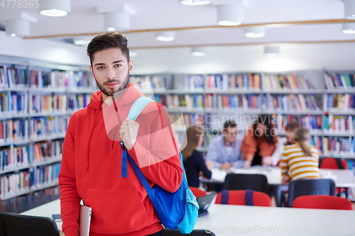 Image of the student uses a laptop and a school library