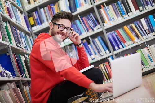 Image of the students uses a notebook, laptop and a school library