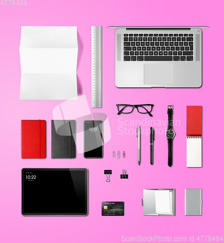 Image of Office desk branding mockup top view isolated on pink