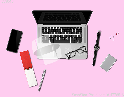 Image of Office desk mockup top view isolated on pink