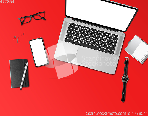 Image of Office desk mockup top view isolated on red