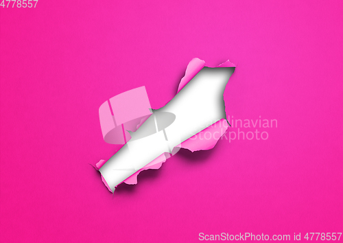 Image of Pink torn paper with hole
