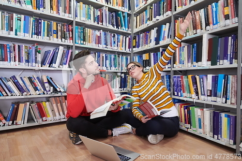 Image of the students uses a notebook, laptop and a school library