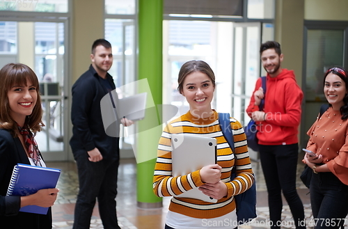 Image of famel student with modern technology in school