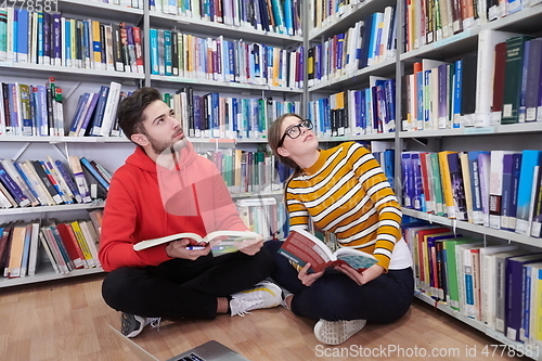 Image of the students uses a notebook, laptop and a school library