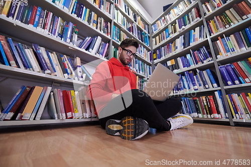 Image of the students uses a notebook, laptop and a school library