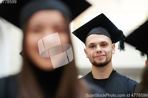 Image of Group of diverse international graduating students celebrating