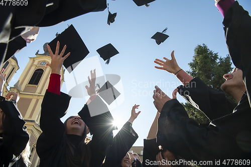 Image of Group of diverse international graduating students celebrating