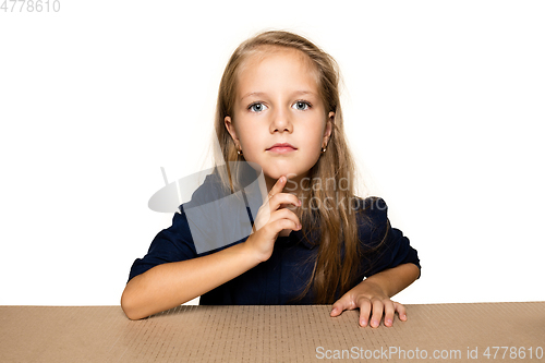 Image of Cute little girl opening the biggest postal package