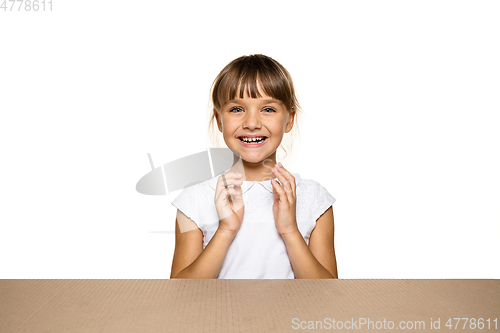 Image of Cute little girl opening the biggest postal package