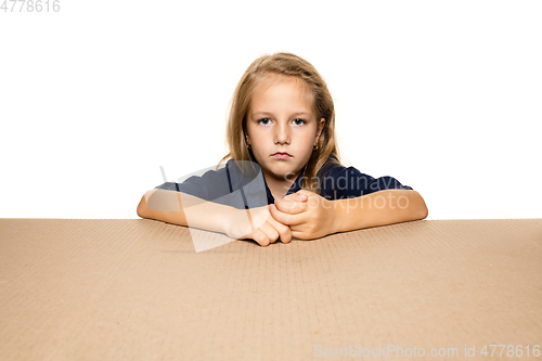 Image of Cute little girl opening the biggest postal package