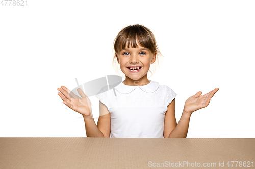 Image of Cute little girl opening the biggest postal package