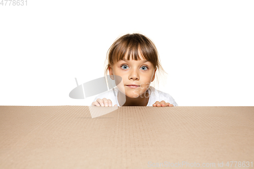 Image of Cute little girl opening the biggest postal package