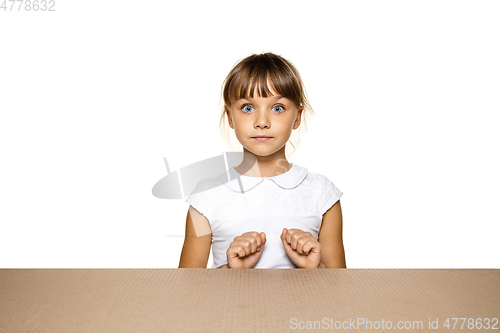 Image of Cute little girl opening the biggest postal package