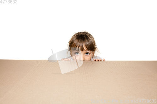 Image of Cute little girl opening the biggest postal package