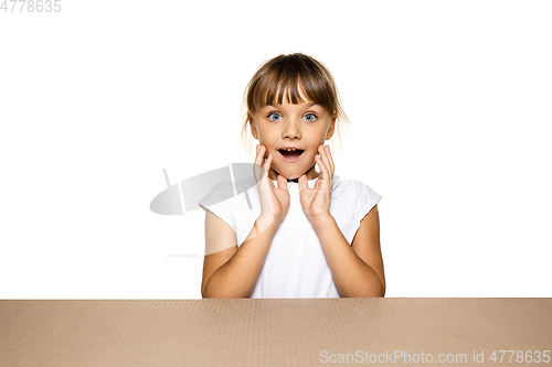 Image of Cute little girl opening the biggest postal package