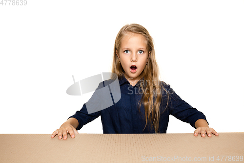 Image of Cute little girl opening the biggest postal package