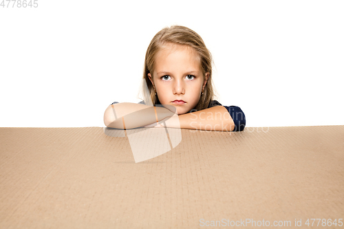 Image of Cute little girl opening the biggest postal package