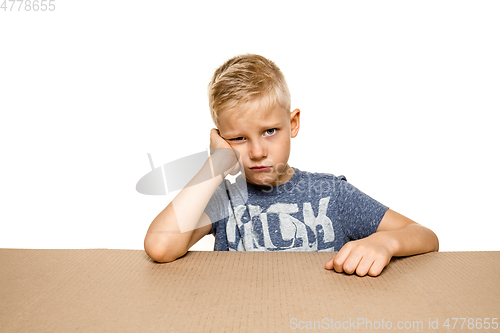 Image of Cute little boy opening the biggest postal package