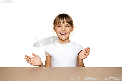 Image of Cute little girl opening the biggest postal package